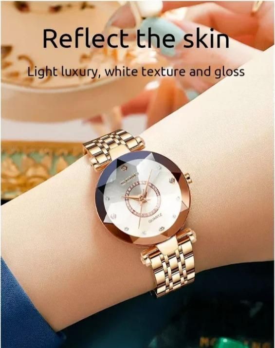 Diamond shaped ladies watch with gold metal band and white textured dial on wrist